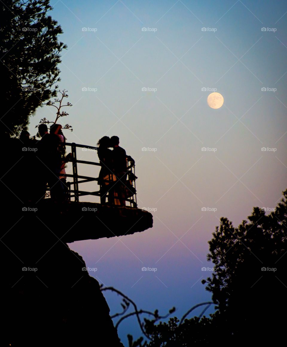 couple silhouette under moonlight