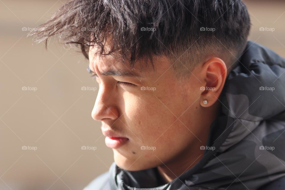 Handsome young man with a short stylish haircut