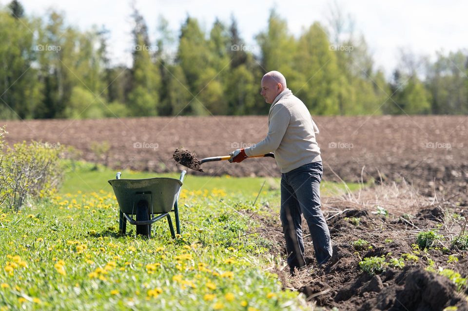 Man working with garden tools