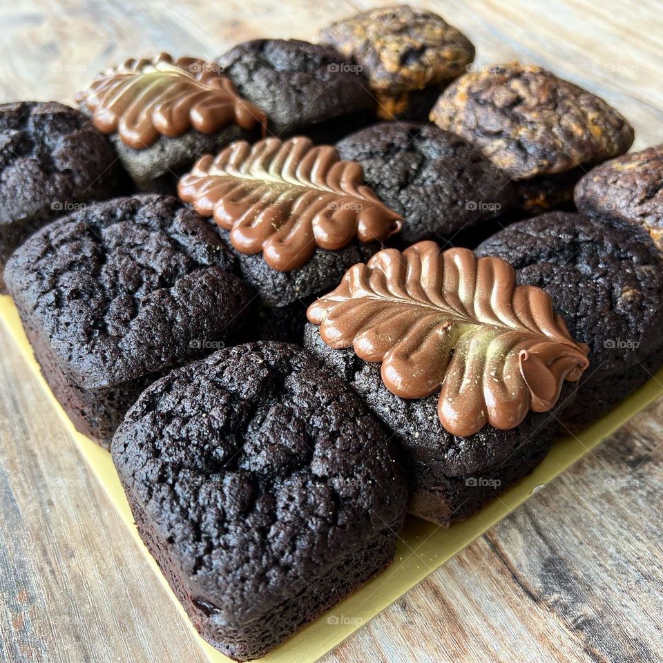 Dark homemade block brownies in different flavours  