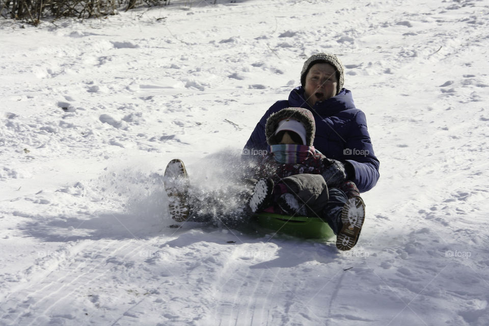 Exciting tobogganing with grandma