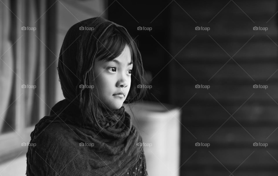 Black and white portrait of a little young girl