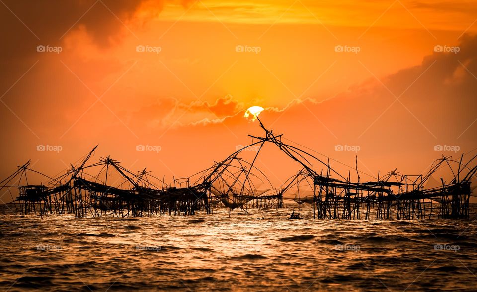 Beautiful sunrise with fishing dip nets in Phatthalung, Thailand amazing spot