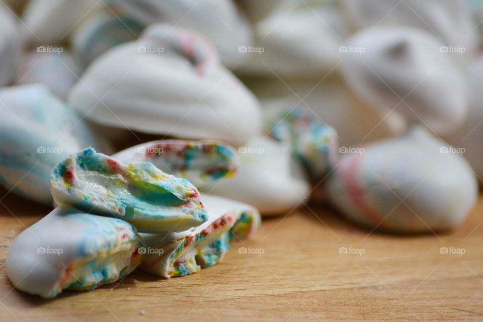 Meringues on wooden table