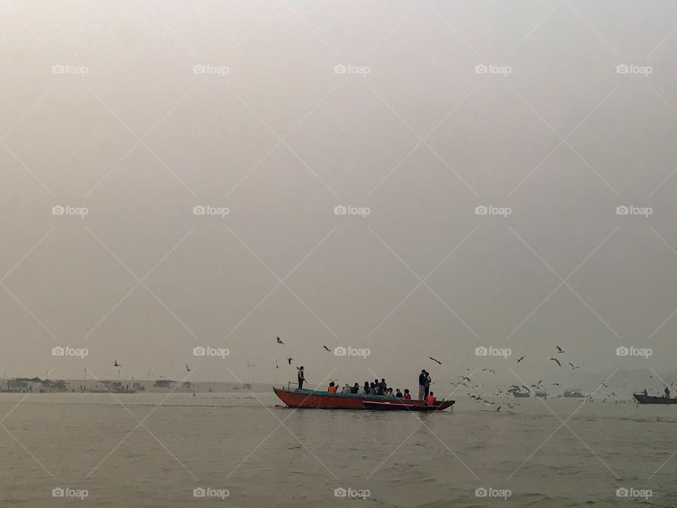 Sightseeing boat ride on the river Ganges ..in morning mists...