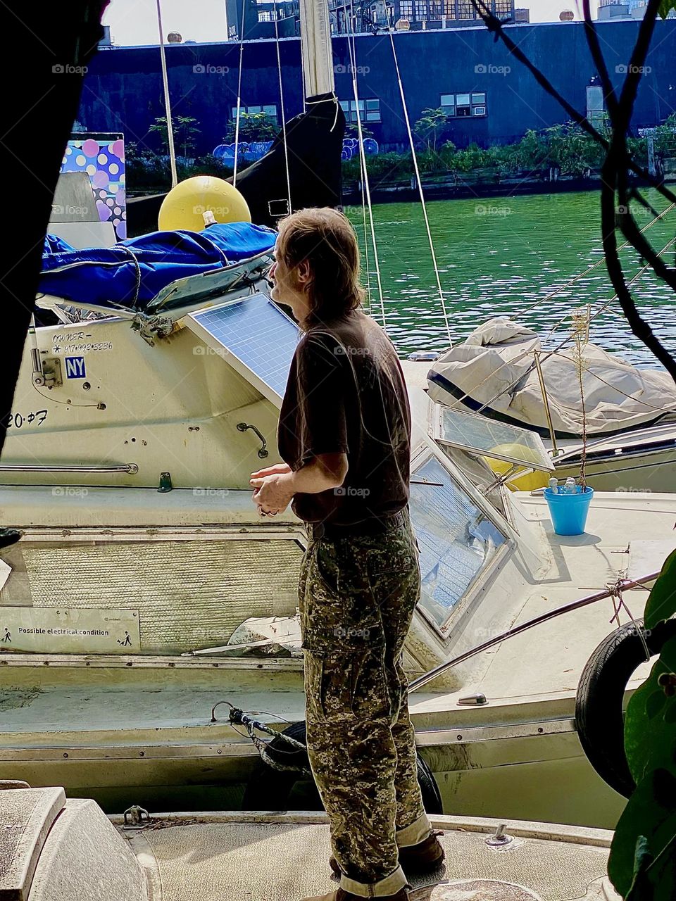 “Timothy Trespas” is standing on the boat next to the “Salvation” contemplating only he knows what … 2023. Hypnotic Productions