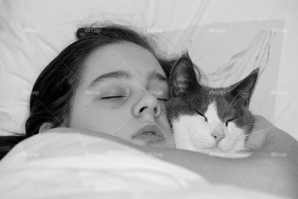 Girl sleeping with cat