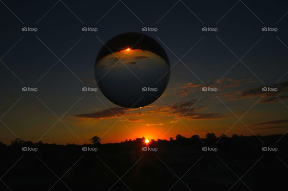 Floating ball. Sphere in the sky
