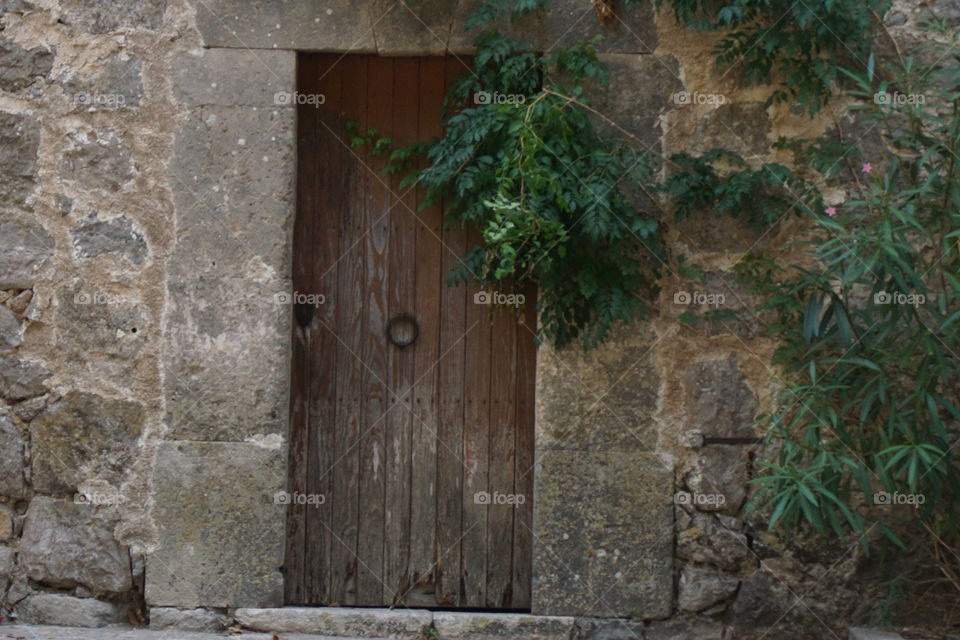 Doors! True Italy. Welcome home. Come on in! Love the wood and stone! 