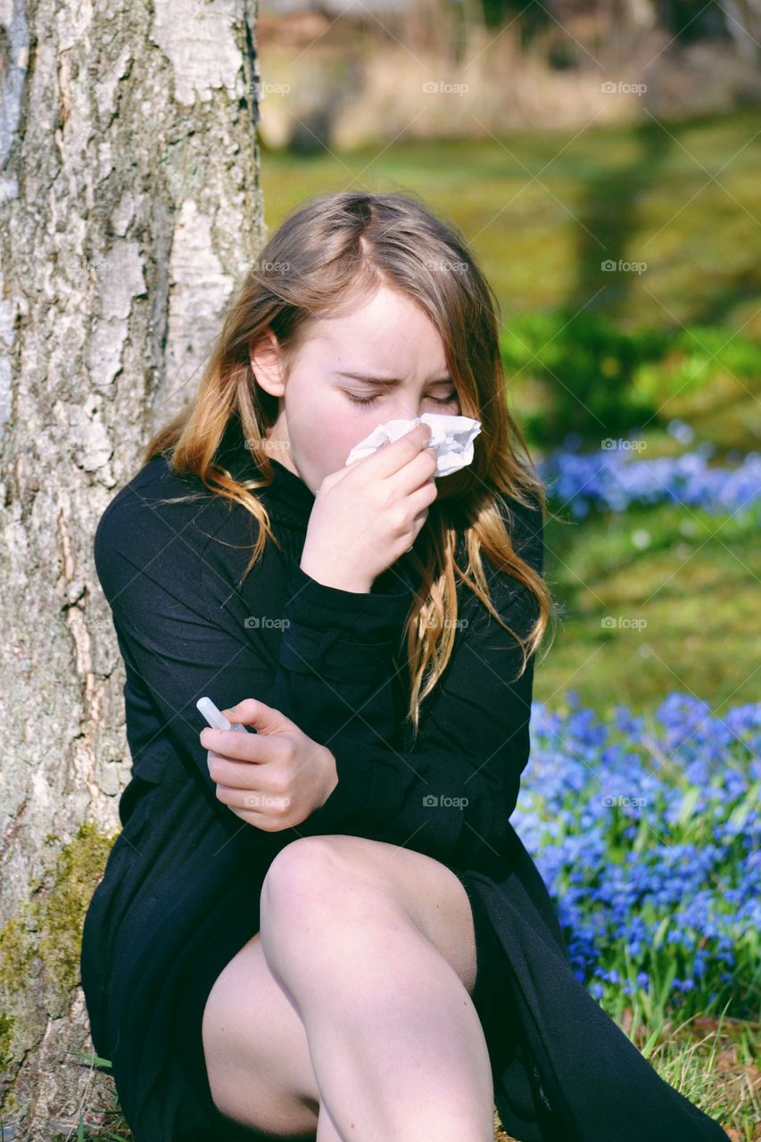Young ill woman with tissue