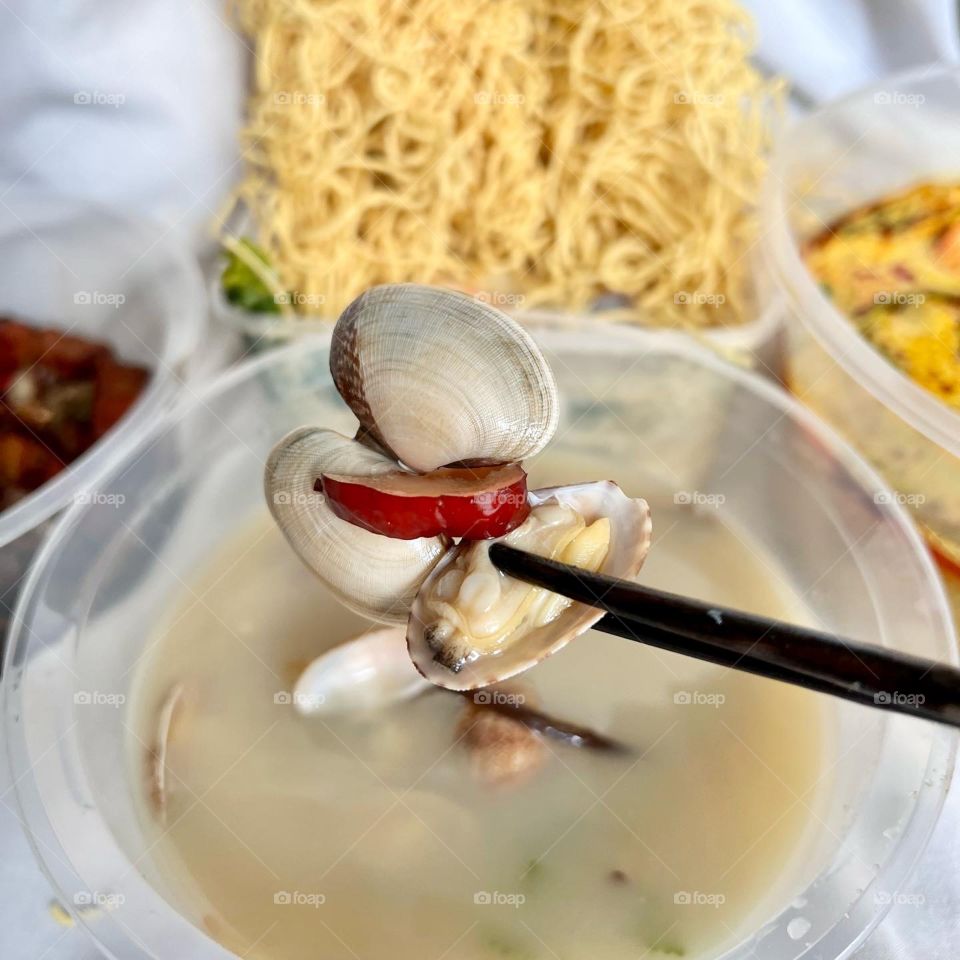 Asian food includes lala clam soup, curry fish head, bitter gourd pork and crispy twin tower noodles 