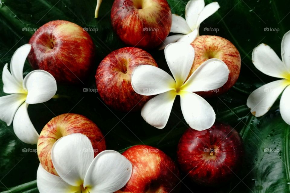 Fresh apples with flowers