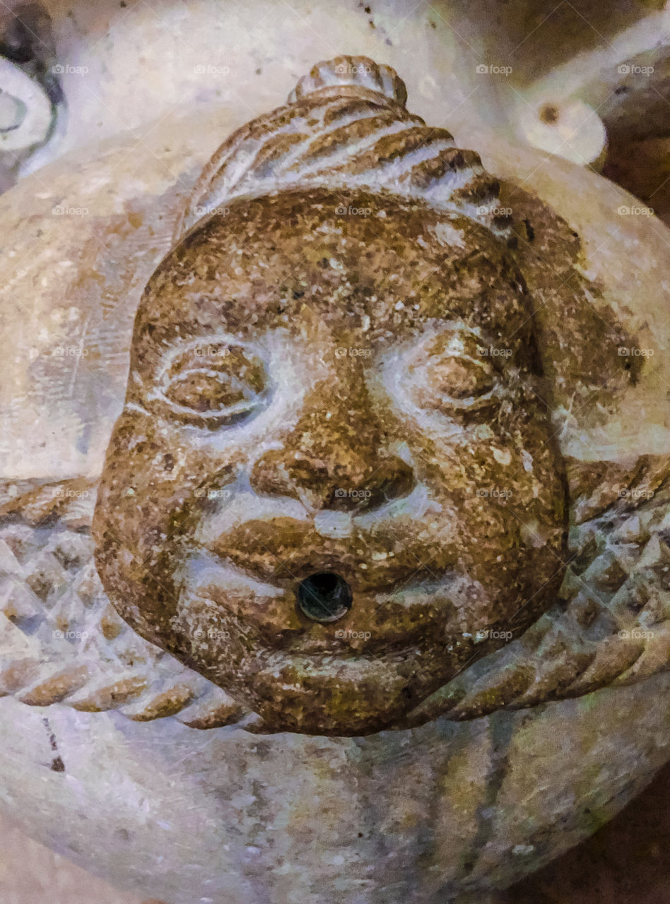 A face carved with a hole in a vessel for wine or water found at Convento de Cristo, Tomar, Portugal 