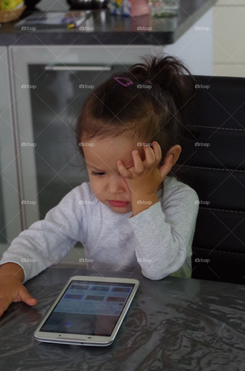 Girl sitting on chair with mobile phone