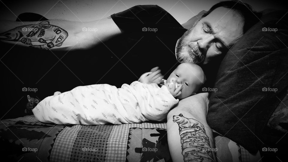 Father and son taking a nap together