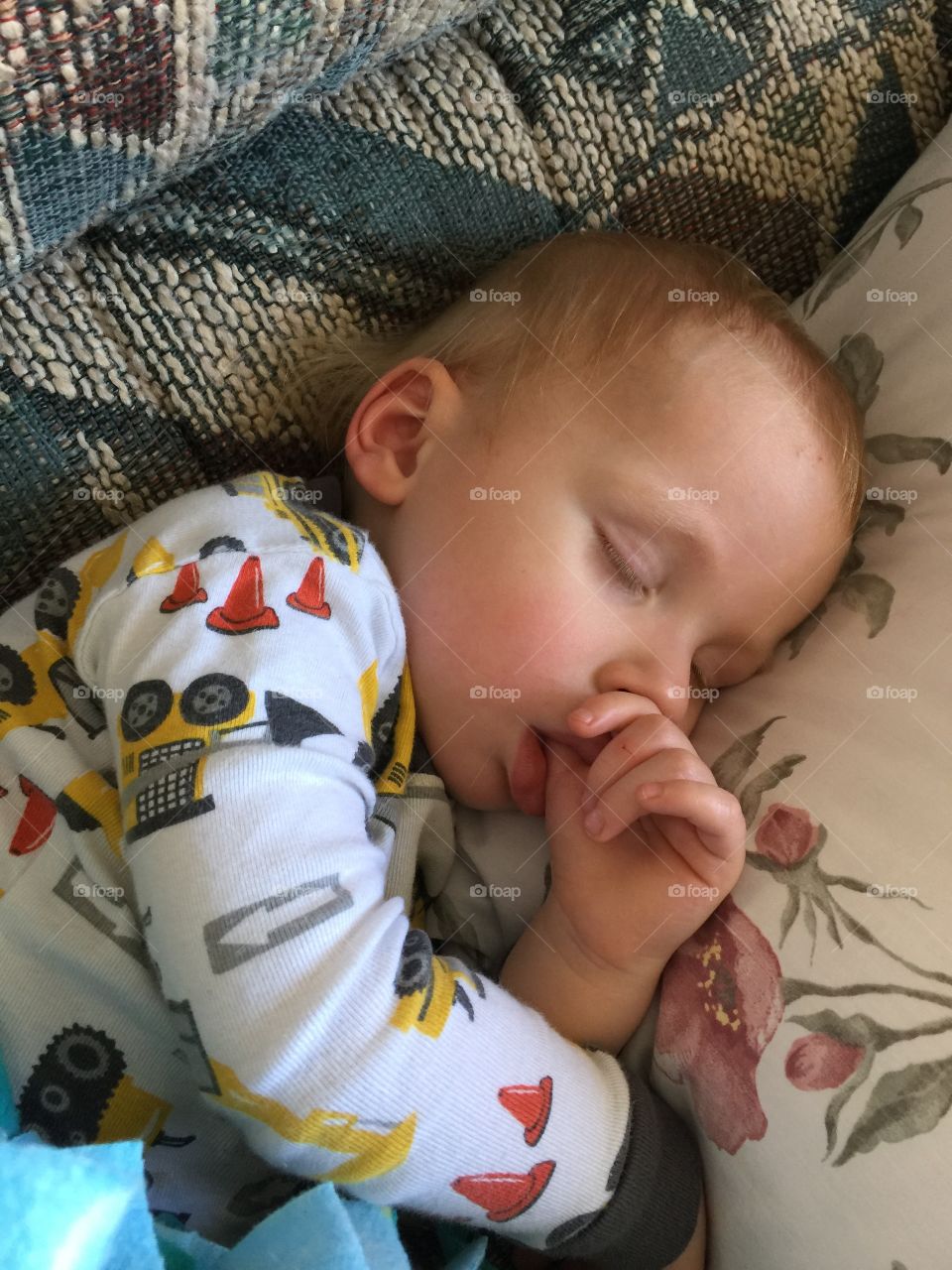 Cute boy resting on sofa