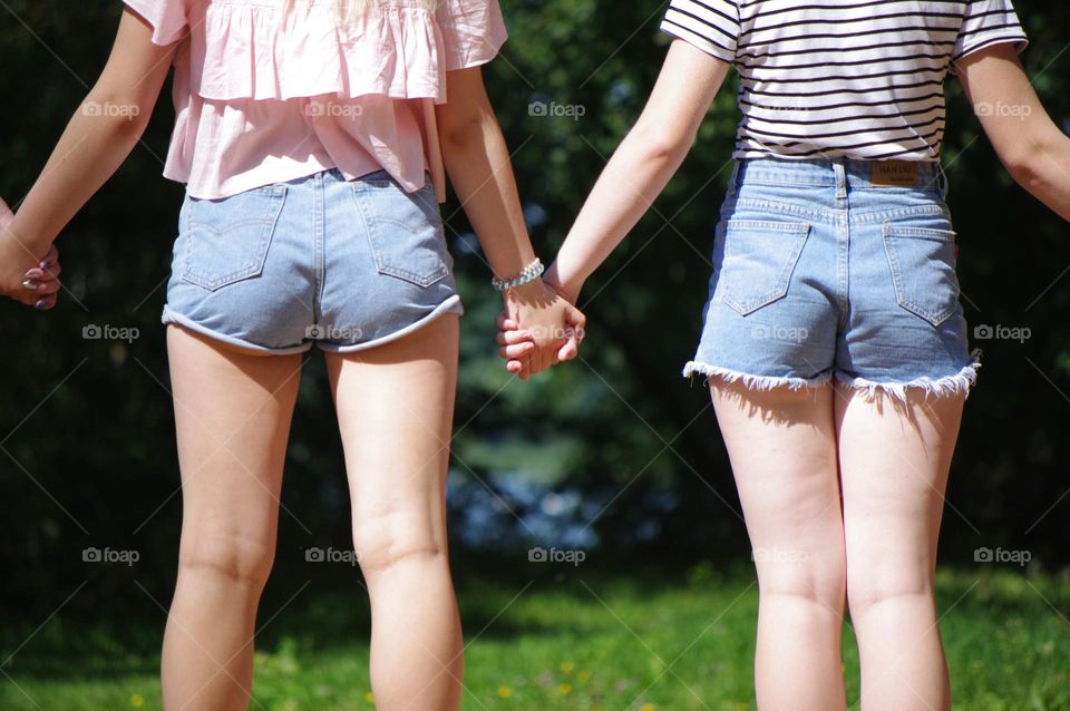 Girls holding hands