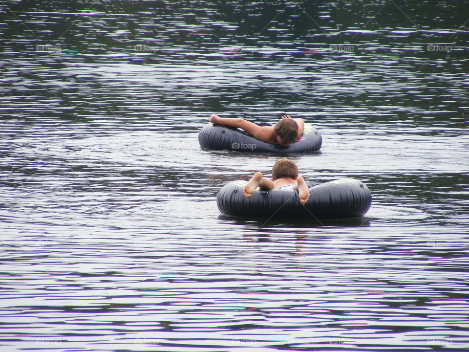 Floating and looking in the water below