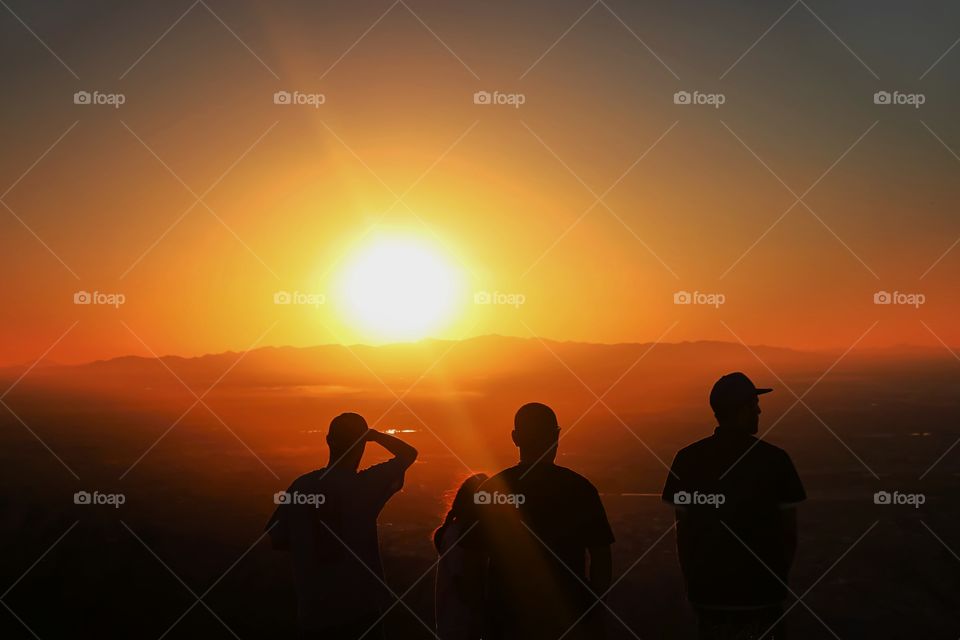 People looking at sunset