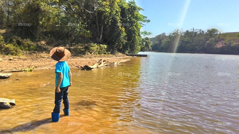 Boy enjoys the river