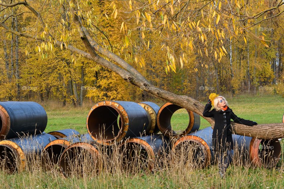 beautiful blonde girl in the autumn park nature lovers