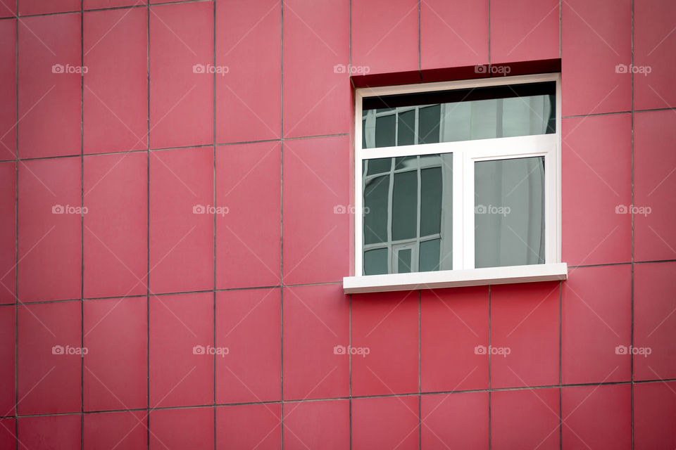 Red tiled building with single window