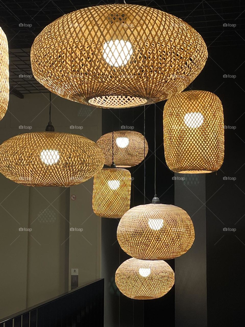 Rattan lampshade in different sizes and shapes, boho style, interior decoration 