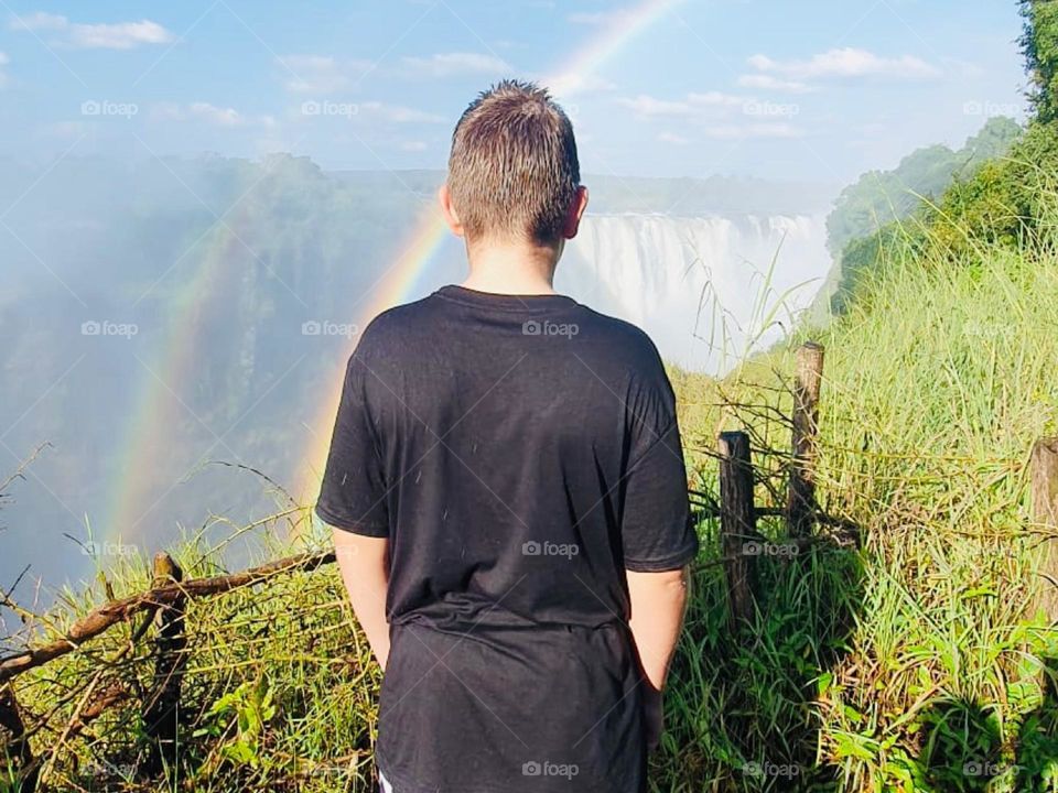 Magnificent rainbow over Victoria Falls, gold at the end of the rainbow 