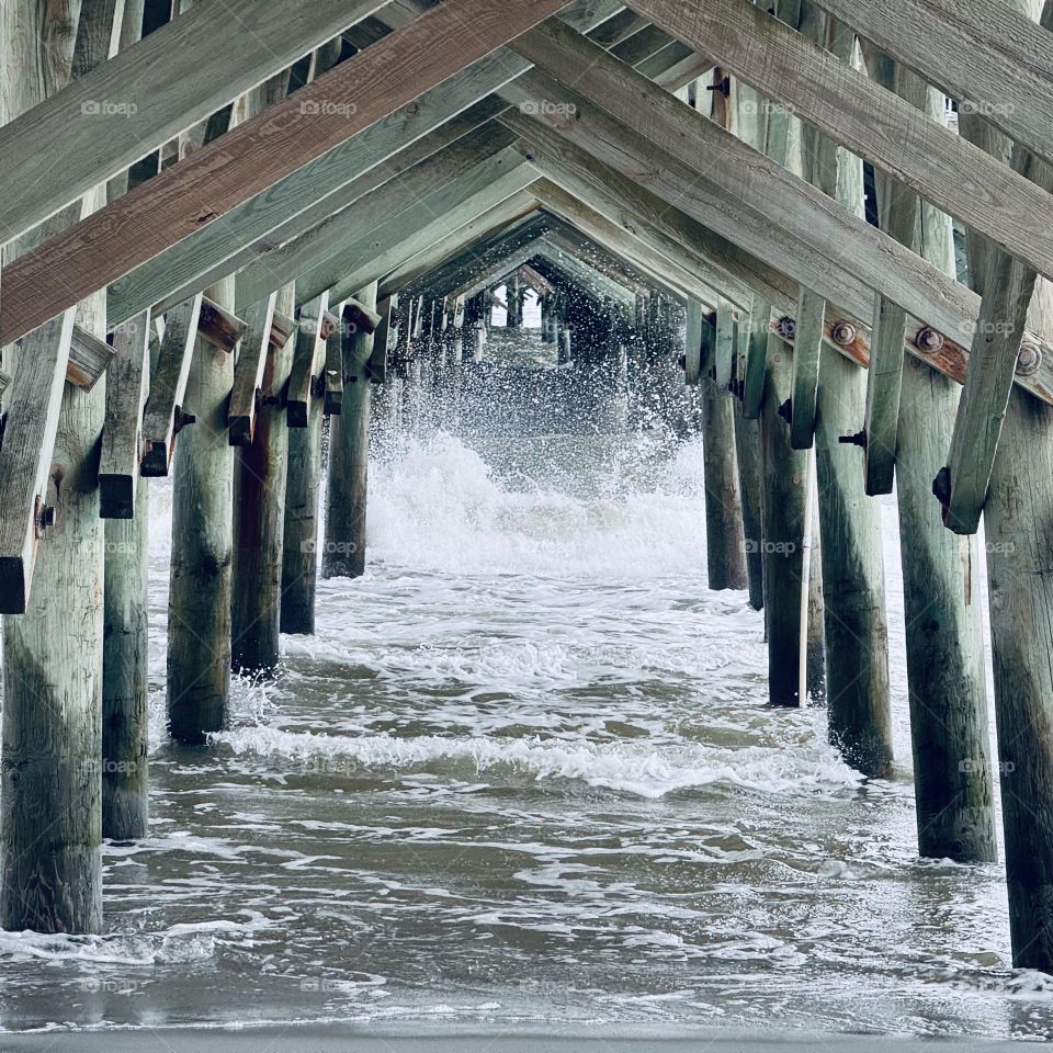 Waves Crashing under Pier