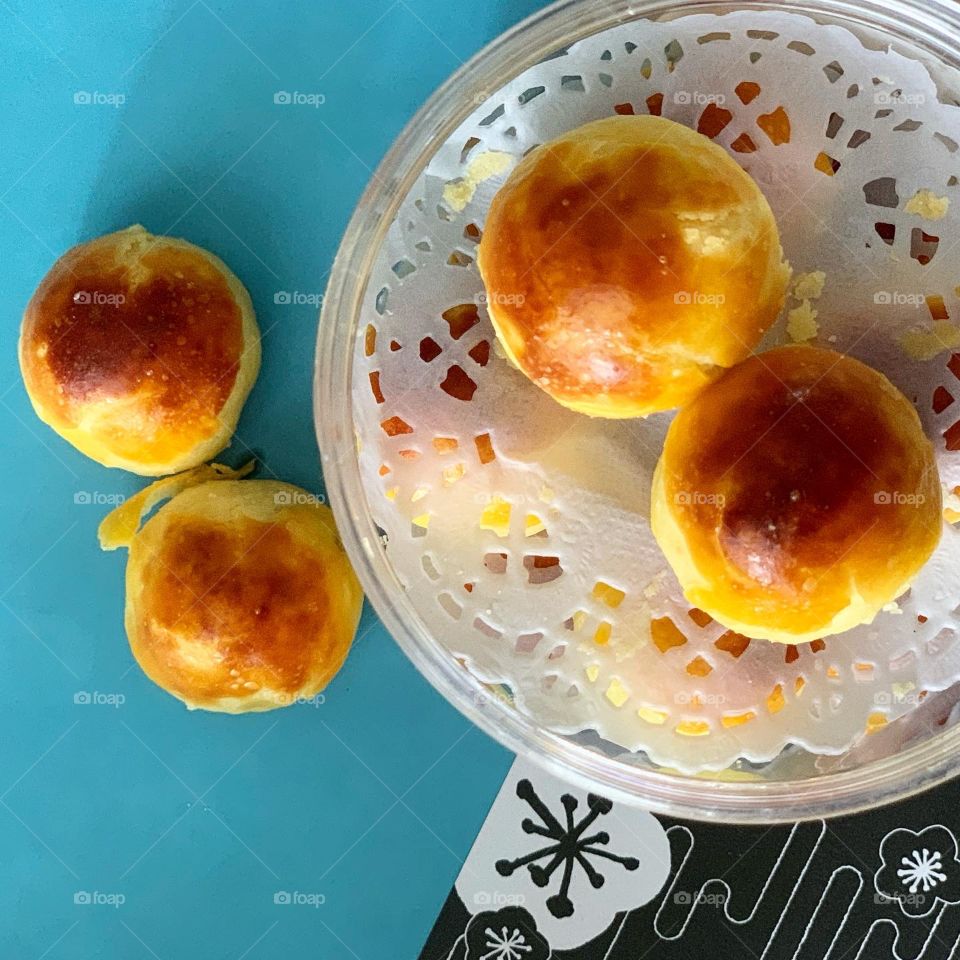 Pineapple balls gor Chinese New Year KN festive blue background setting 