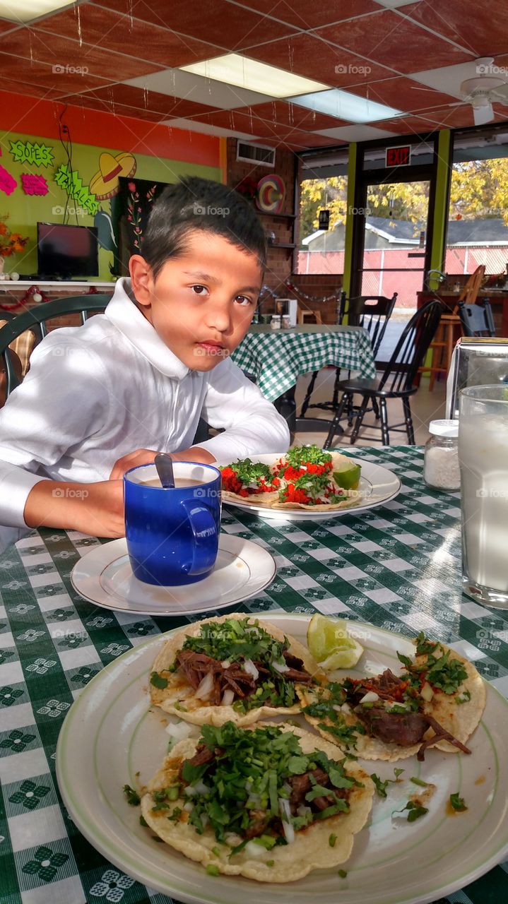 Mexican boy in restaurant