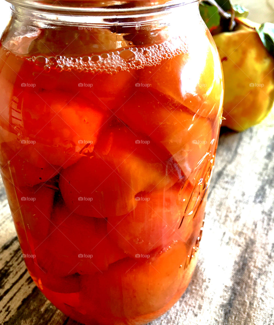 Quince fruit preserves in canning jar closeup 