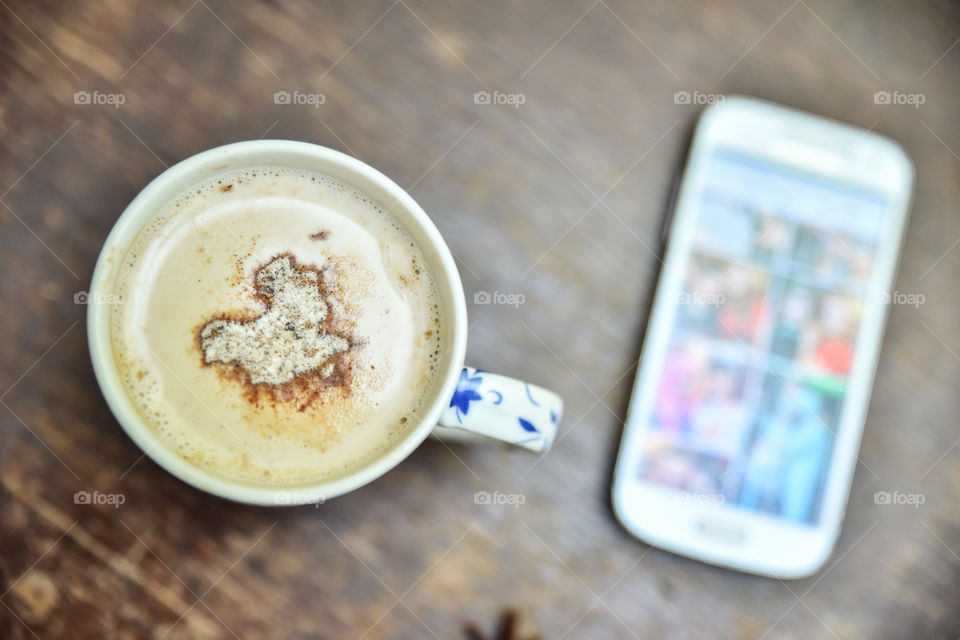 coffee cup and a phone