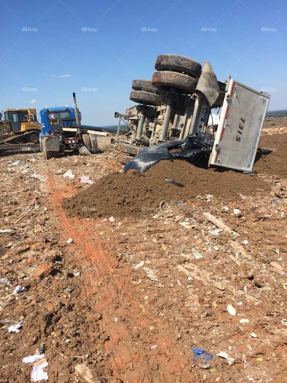 Republic Services tractor trailer with a roll over in the McCarty Landfill