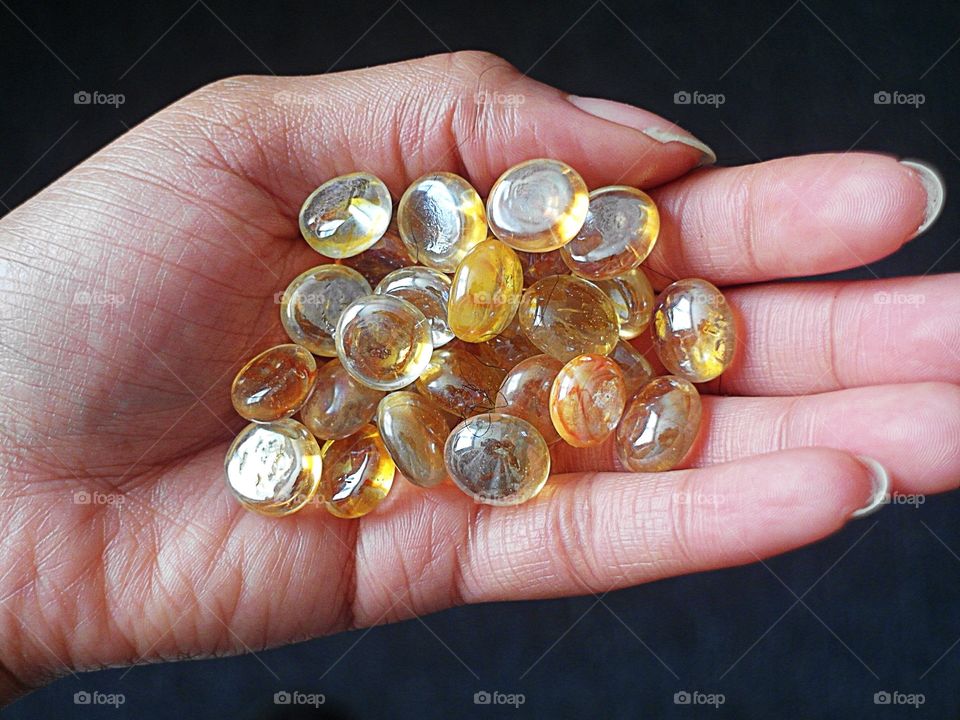Hand holding glass beads 