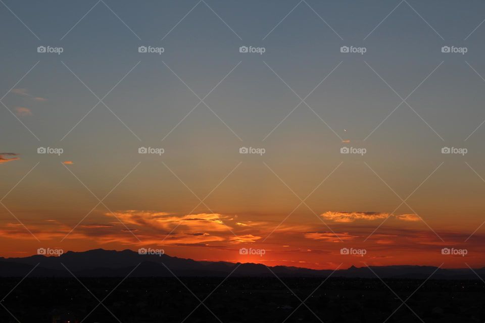 taking in the view of a sunrise in the desert of Nevada