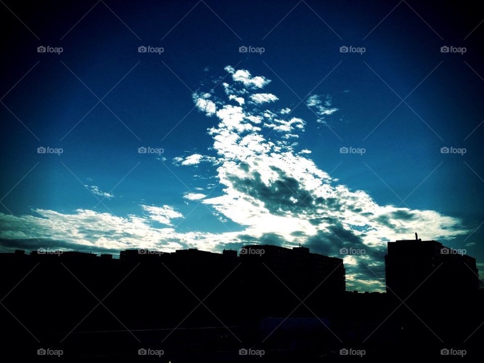 Clouds over buildings