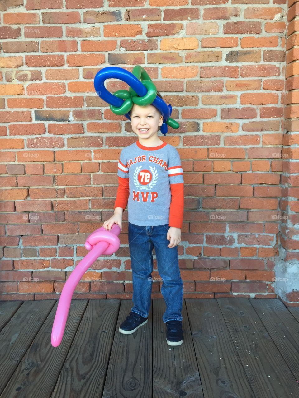 5 year old boy with air balloons 