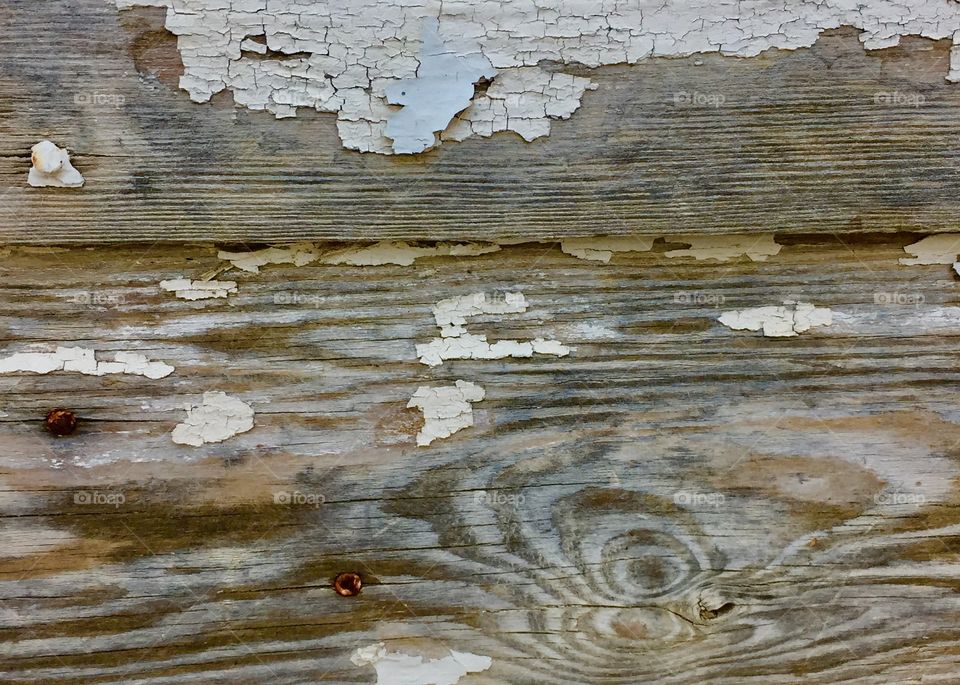 Wood grain siding with peeling paint 