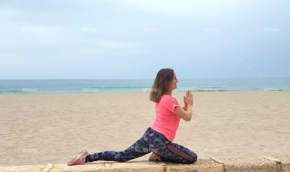 Yoga#training#concentrated#balance#position#beach