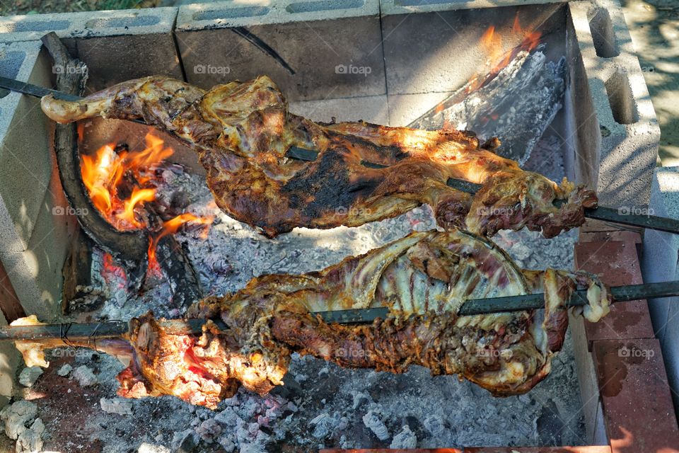 Goat Meat Roasting Over Hot Coals