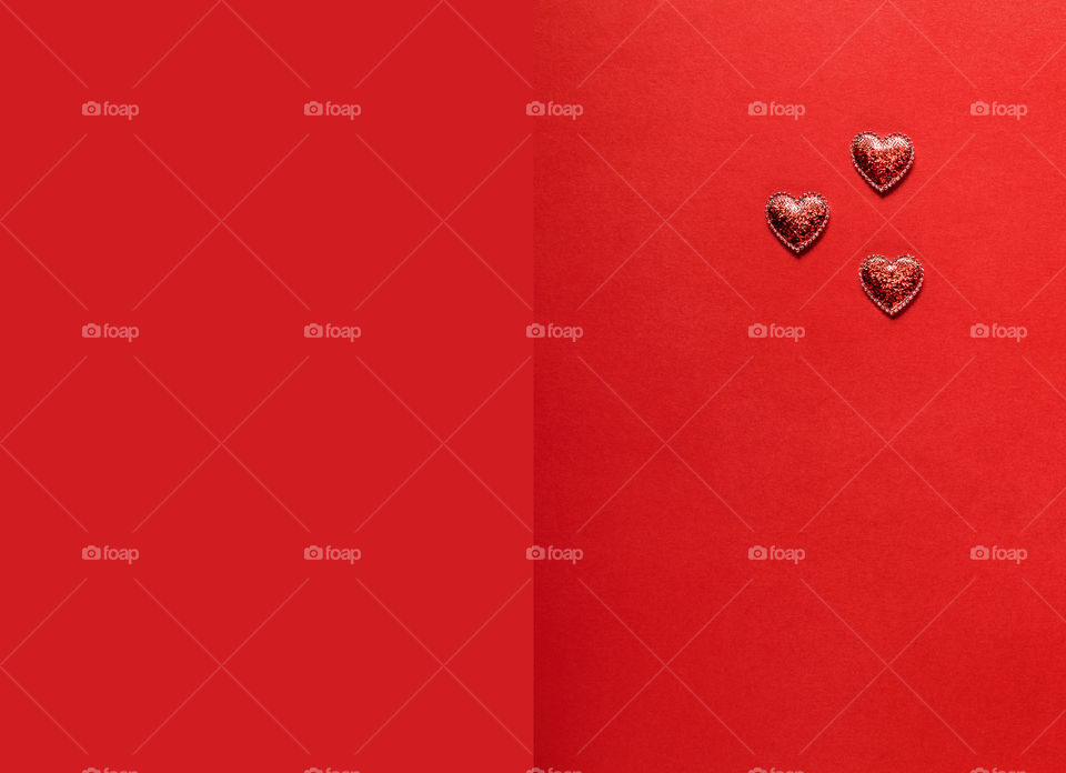 Postcard. Red hearts on a red background. Valentine's Day.