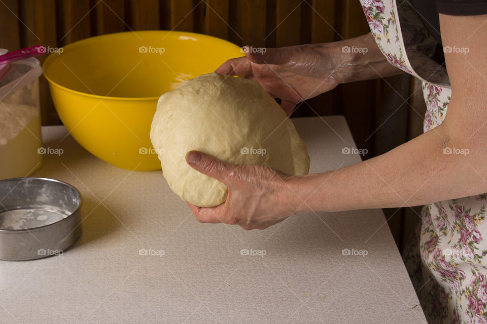 woman prepares raw dough,  close up . cooking at home concept