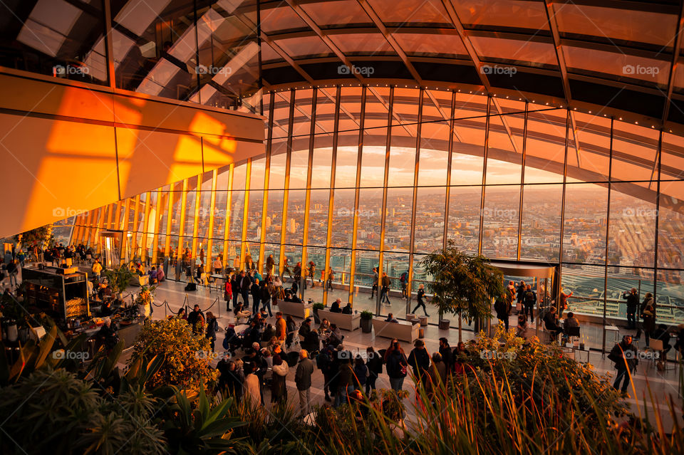 Publicly accessible The Sky Garden Terraces during sunset with incredible views over London. Landmark skyscraper in businesses district of London. UK.
