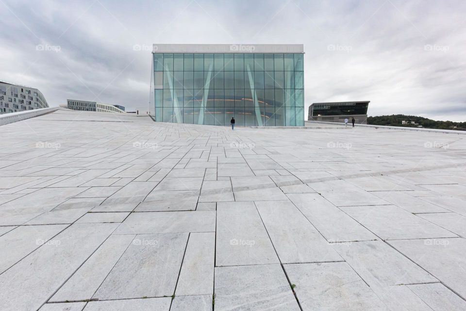 The opera house in Oslo surrounded by marble stone plates, beautiful modern architecture in Norway 
