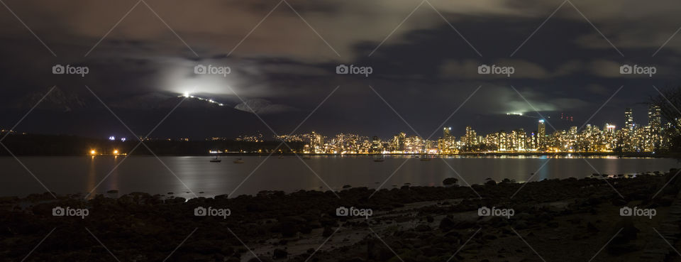 A panoramic long exposure shot of Vancouver, BC at night