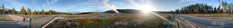 Old Faithful at Dawn.  Panorama of the Old Faithful area in Yellowstone National Park,  Wyoming.