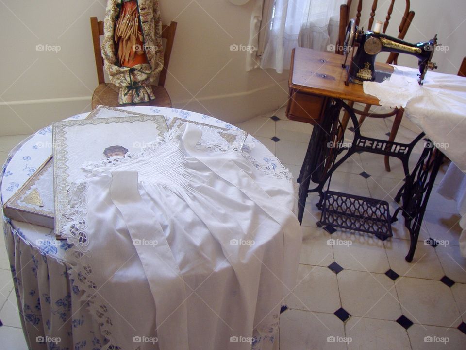 Retro Interior design of a service room with a Zinger sewing machine and a wooden table