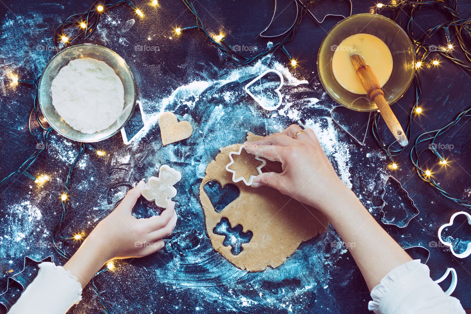 High angle view of woman preparing cookies