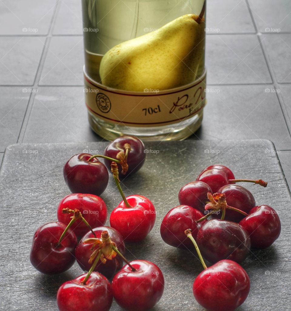 Berries and pear in a bottle 